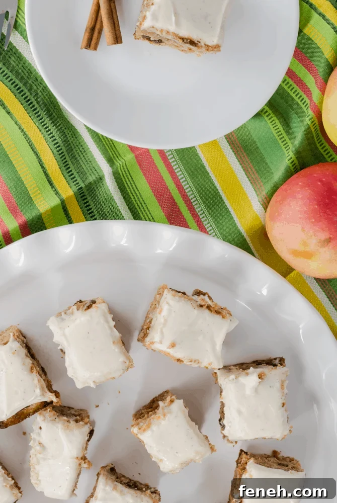 Top view of raisin spice bars on a white platter.