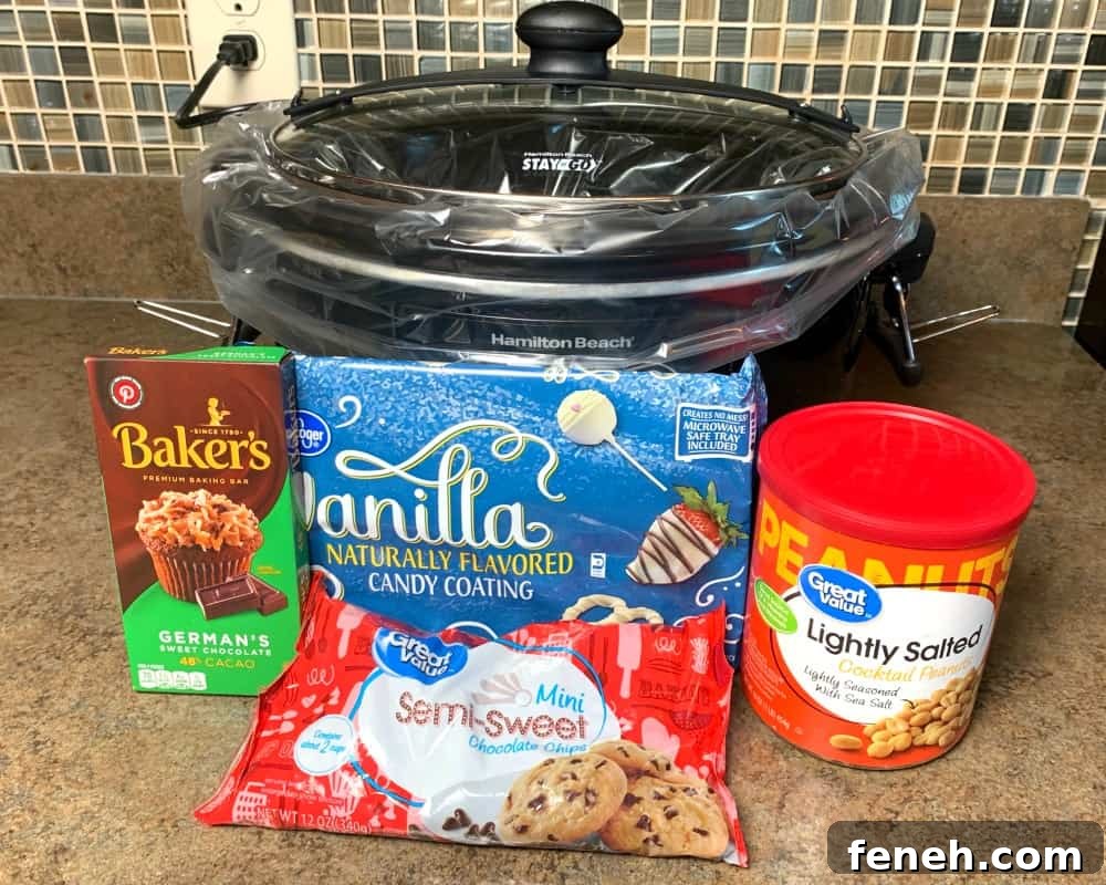 4 ingredients needed to make chocolate covered peanut clusters sitting in front of slow cooker - German chocolate, semi-sweet chocolate chips, white almond bark & peanuts