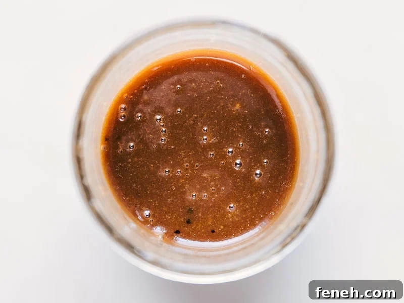 This delicious Balsamic Vinaigrette takes mere minutes to whip together and no special kitchen appliances needed! Image of the Balsamic Vinaigrette all mixed together