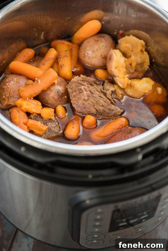 Pressure Cooker Pot Roast cooked in an Instant Pot with potatoes, carrots and juices