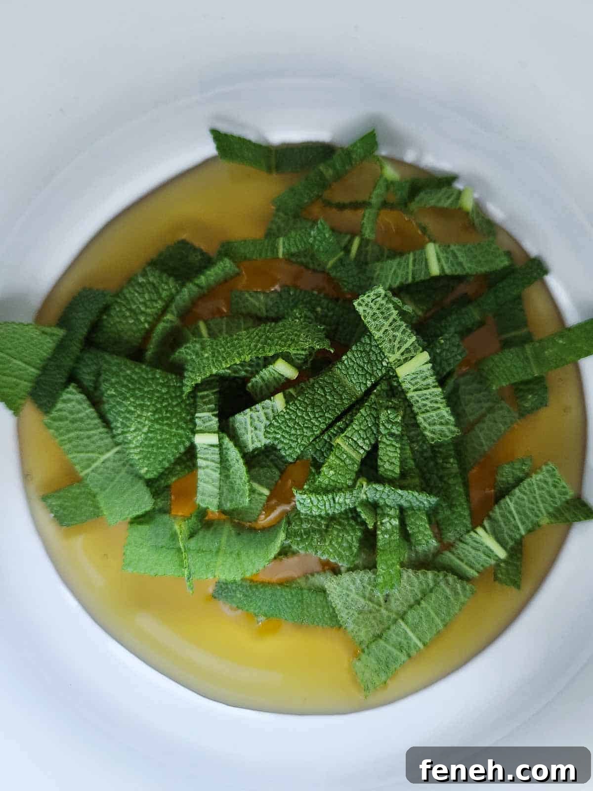 Sage and honey in a small pot.