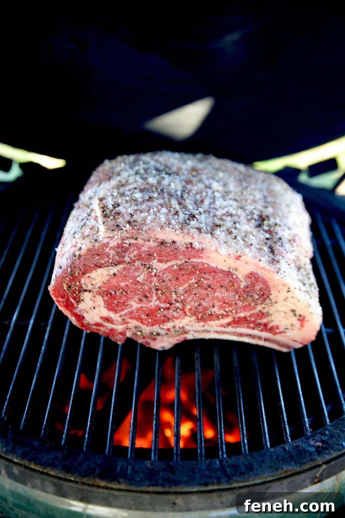 Searing prime rib roast on a grill.