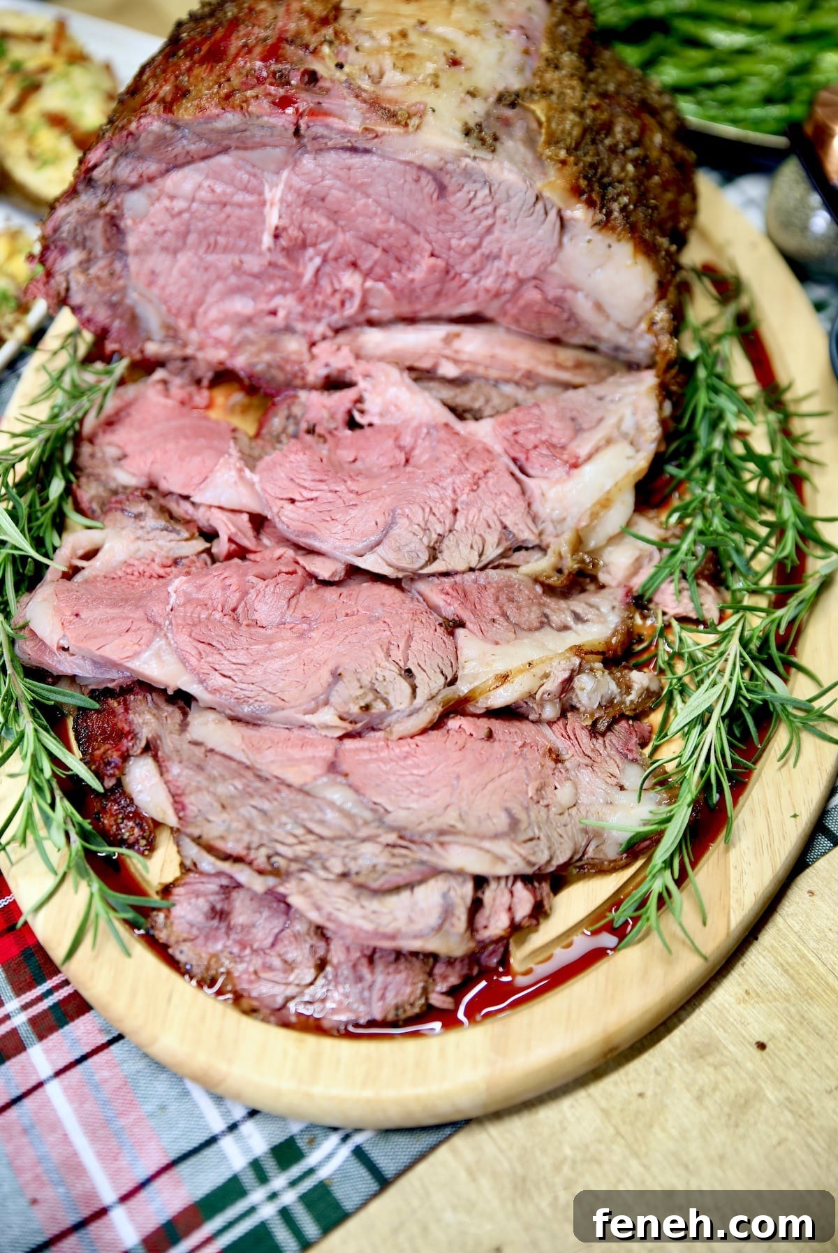 Sliced prime rib roast on a cutting board.