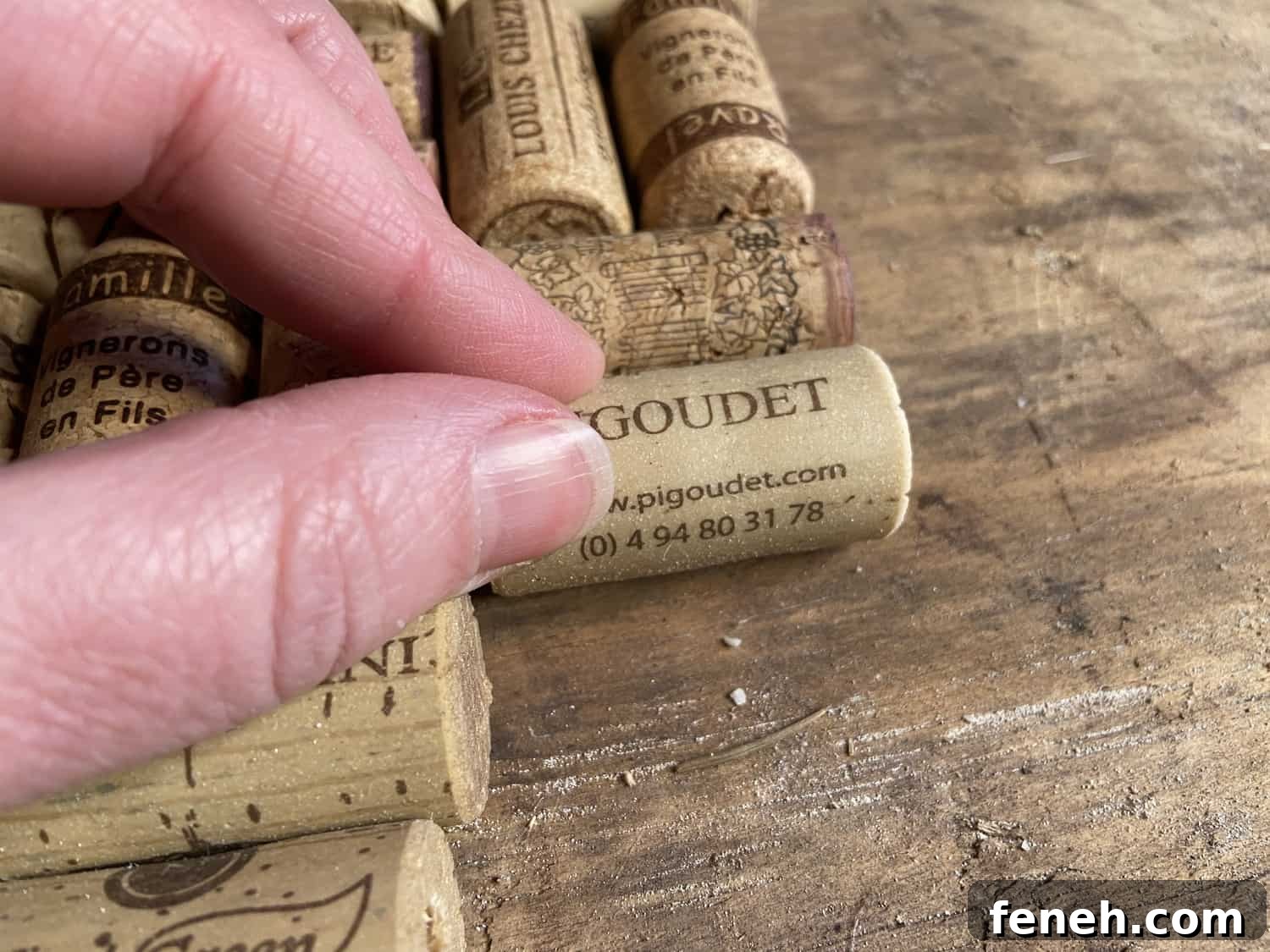 Gluing corks to a piece of wood.