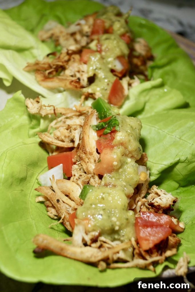 Crispy Slow Cooker Chicken Tacos (Whole30-Friendly) 2 Whole30 slow cooker crispy chicken tacos in lettuce leaves