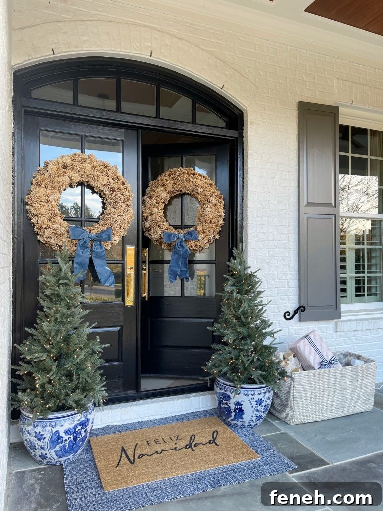 front door with pinecone wreath from Serena lily