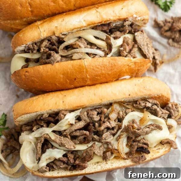 Two sandwiches with meat and onions