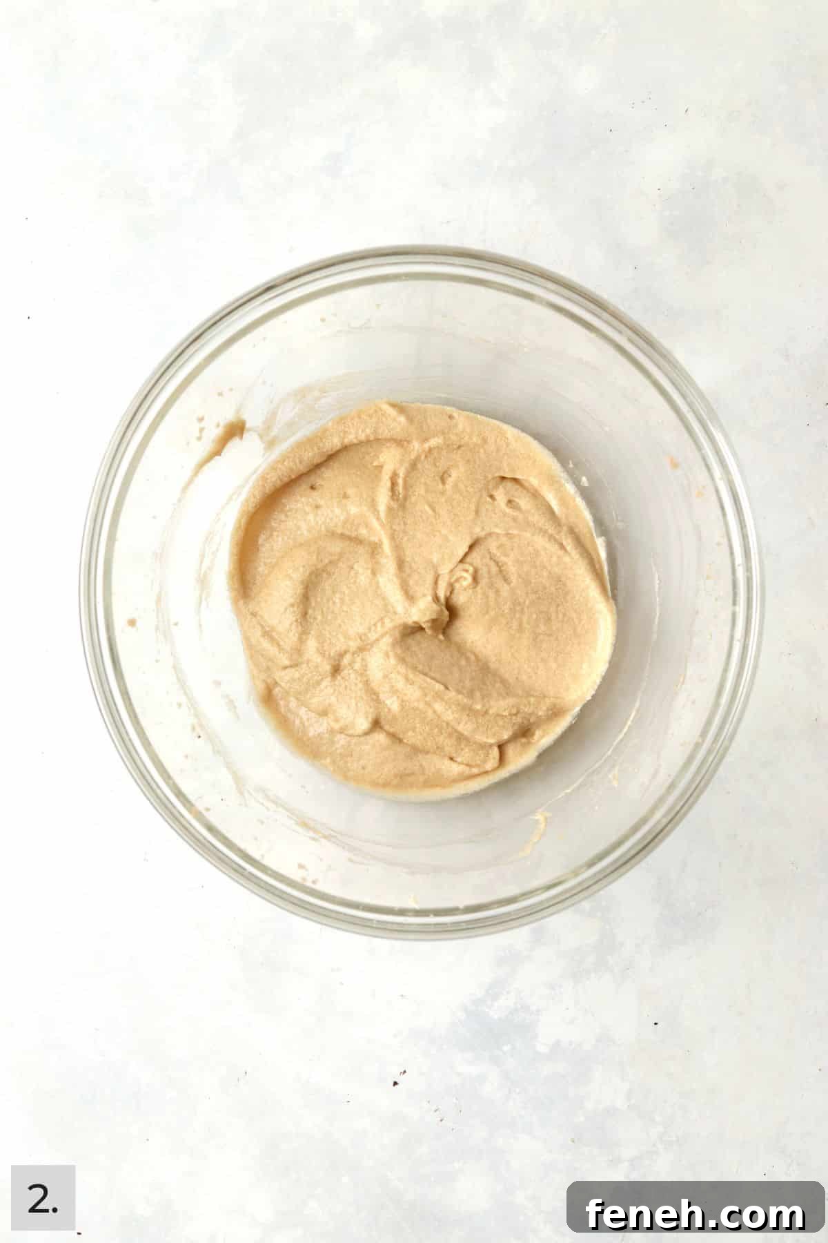 Creamed butter, sugar, brown sugar, egg, and vanilla in a glass mixing bowl.