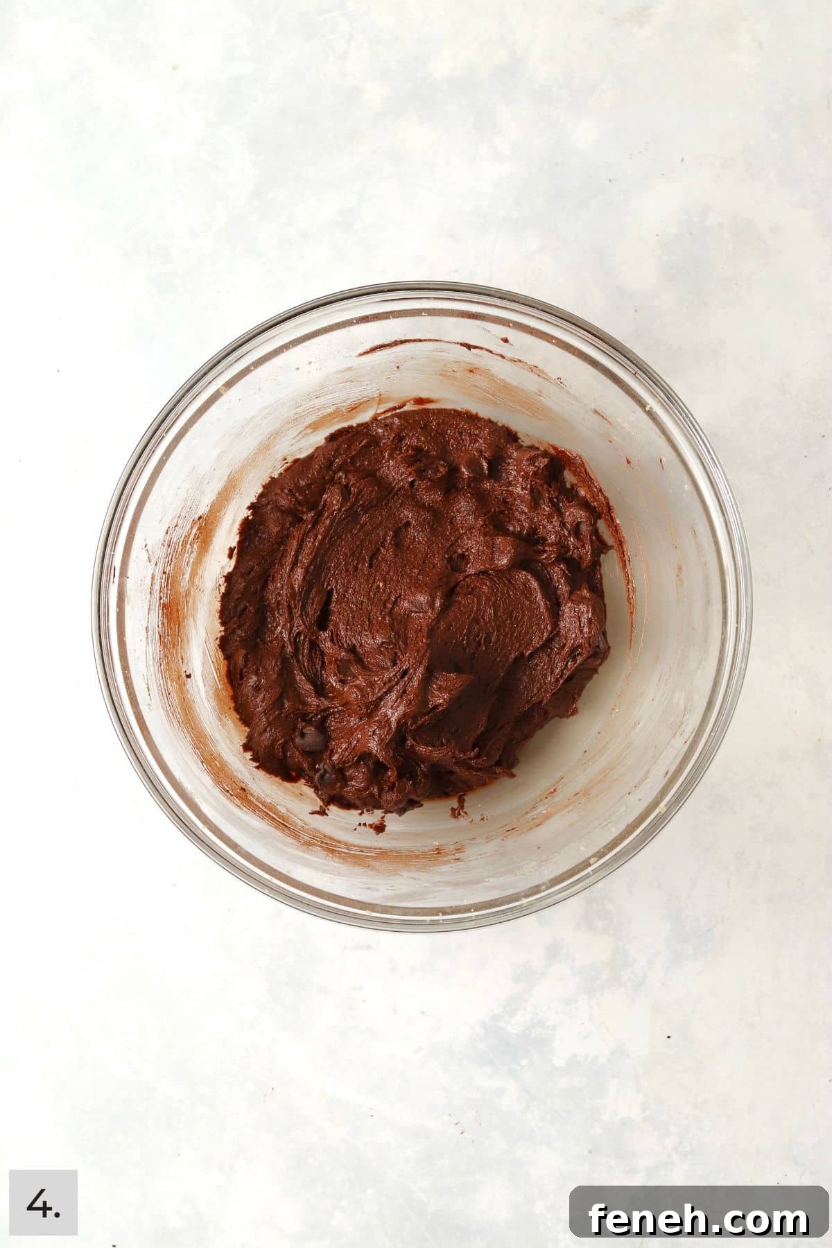 Brownie cookie dough in a glass bowl.