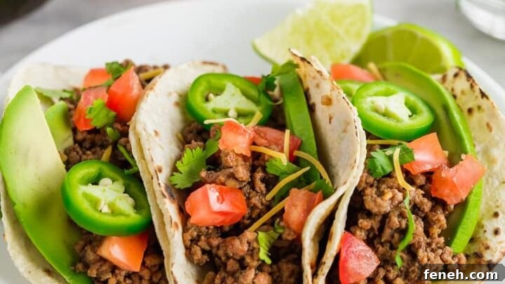 three gluten-free tacos on a white plate