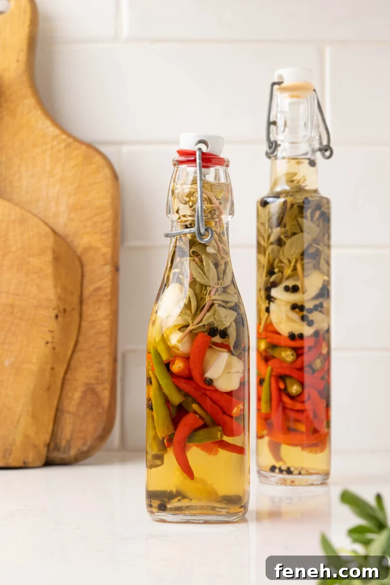 two bottles of hot sauce on a white counter