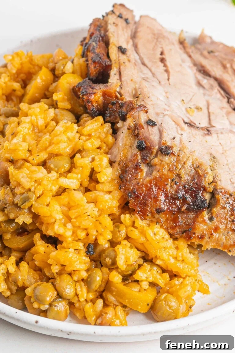 pernil with arroz con gandules on a plate