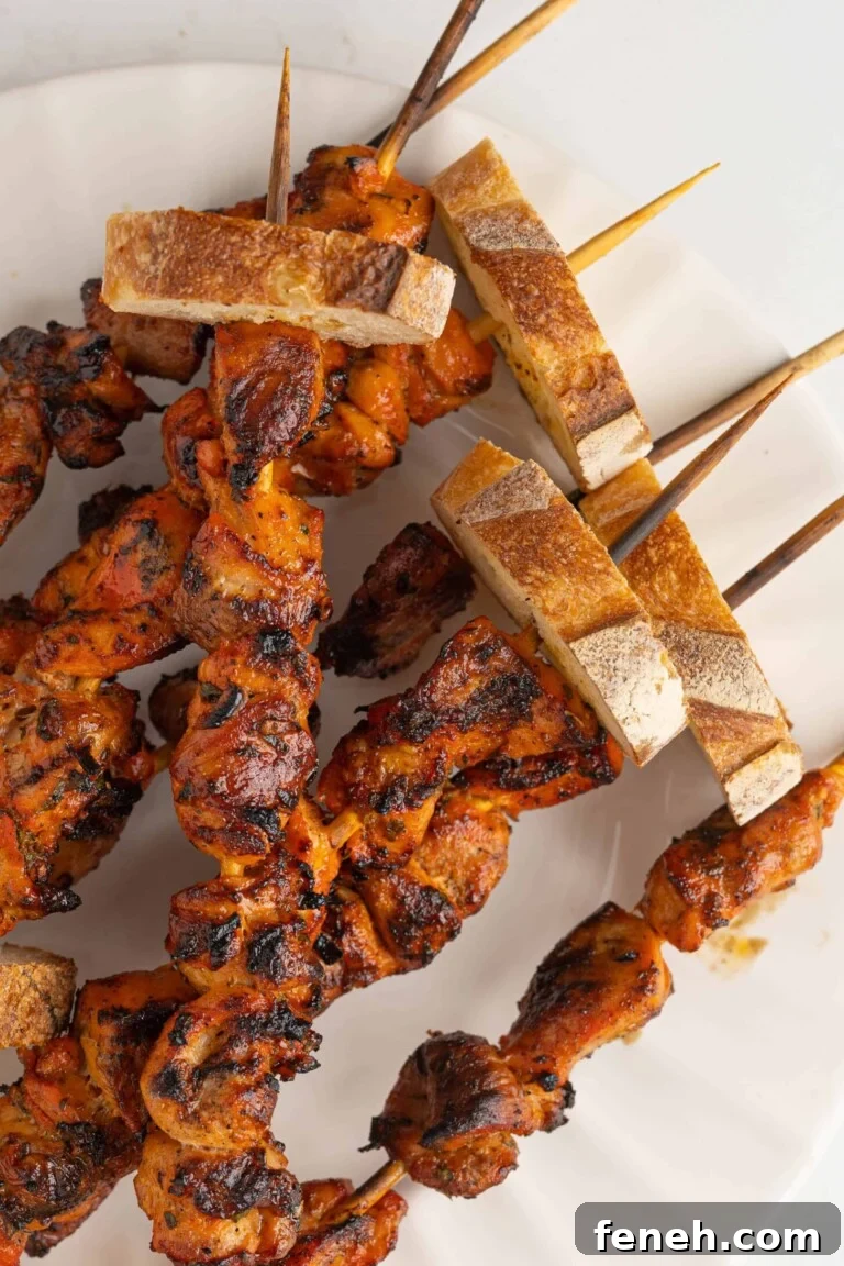 a plate of pinchos de pollo