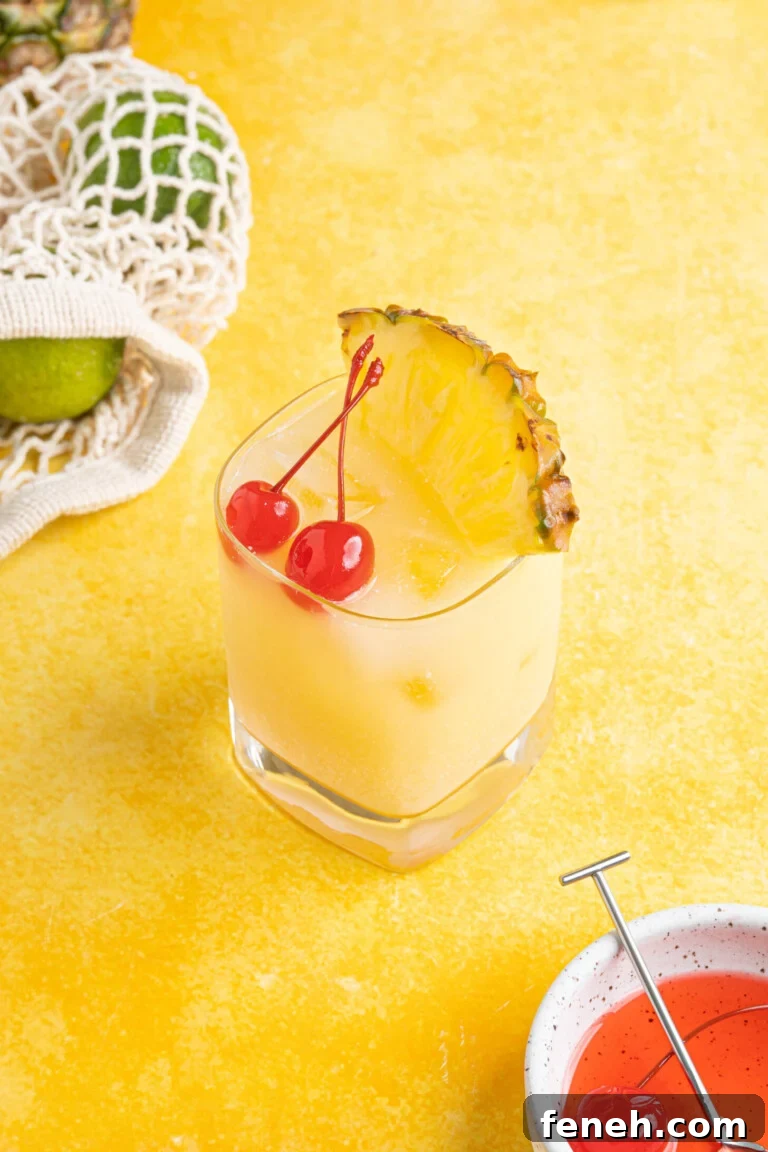 a piña colada on the rocks on a yellow counter
