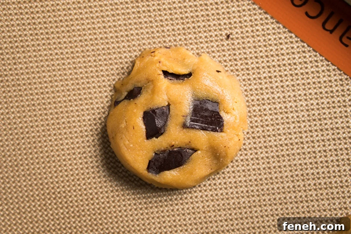 Unbaked flourless cookie dough on a baking mat