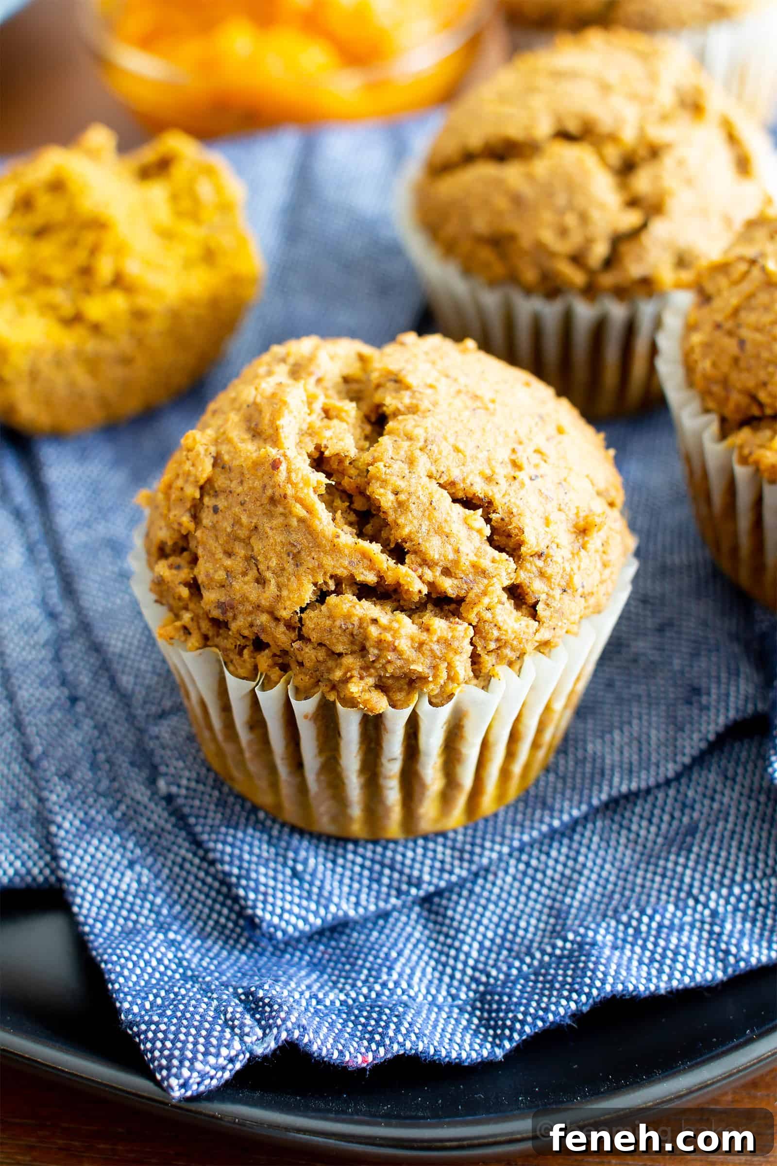Easy Vegan Gluten Free Pumpkin Muffins Recipe (V, GF): an easy recipe for moist ‘n fluffy pumpkin muffins bursting with your favorite fall spices. Made with healthy, whole ingredients. #Vegan #GlutenFree #Pumpkin #Muffins #PumpkinSpice #DairyFree #Healthy #Fall #RefinedSugarFree | Recipe at BeamingBaker.com