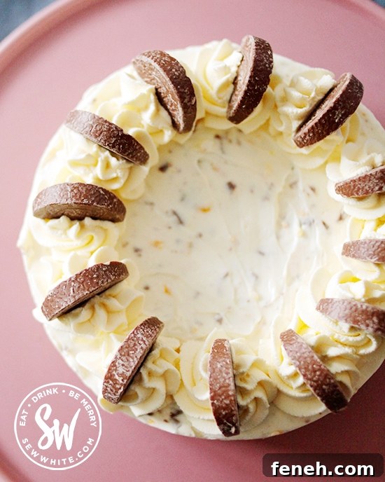 Terry's chocolate orange segments on whipped up spirals of cream on the cheesecake