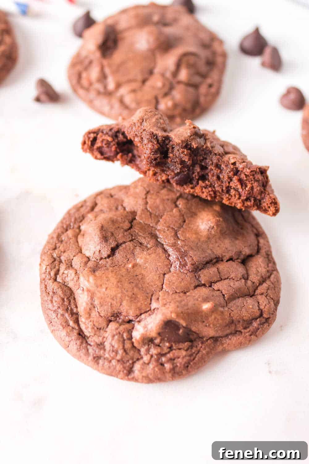 A few cookies with one cut in half.