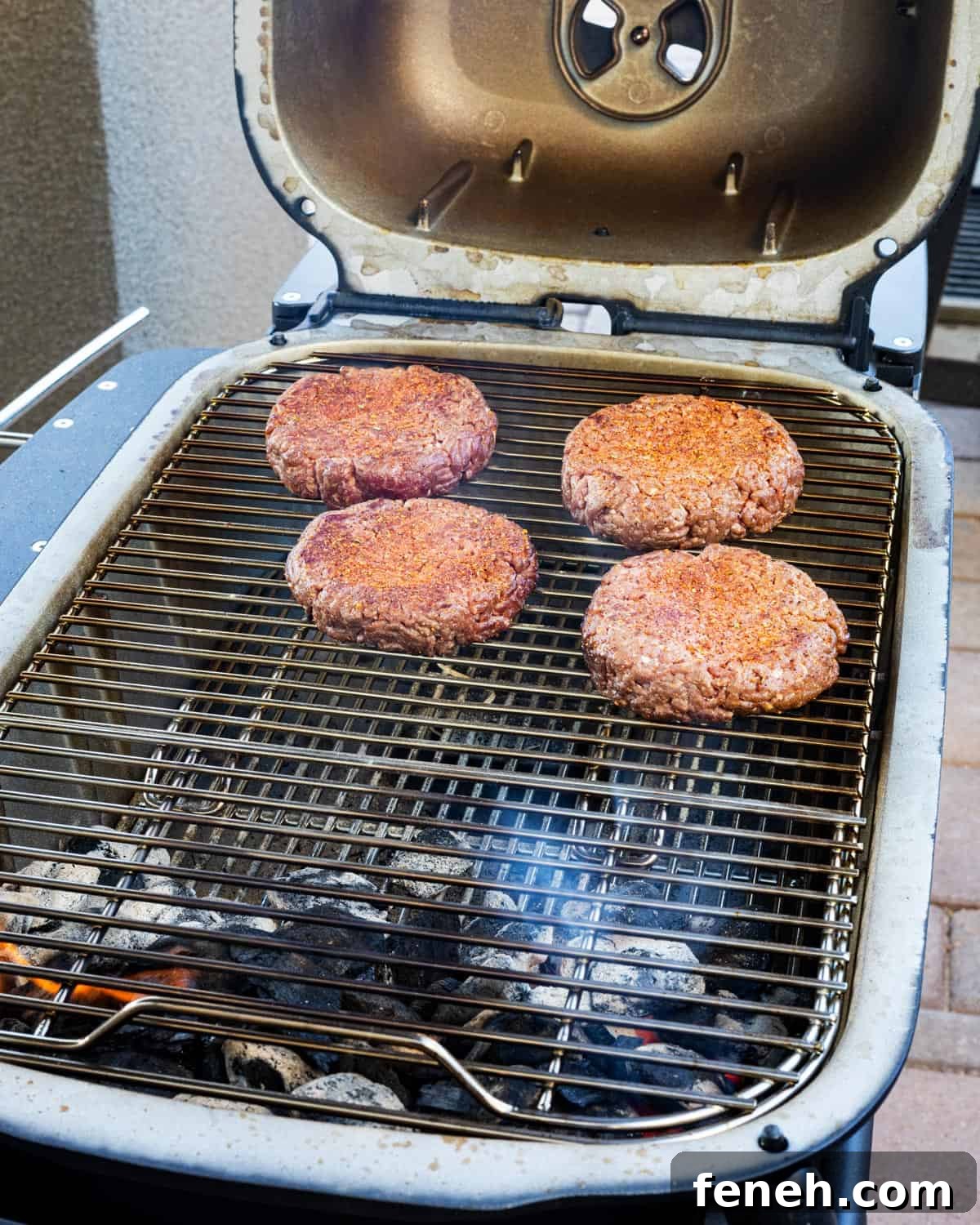 Beef patties hitting the grill.