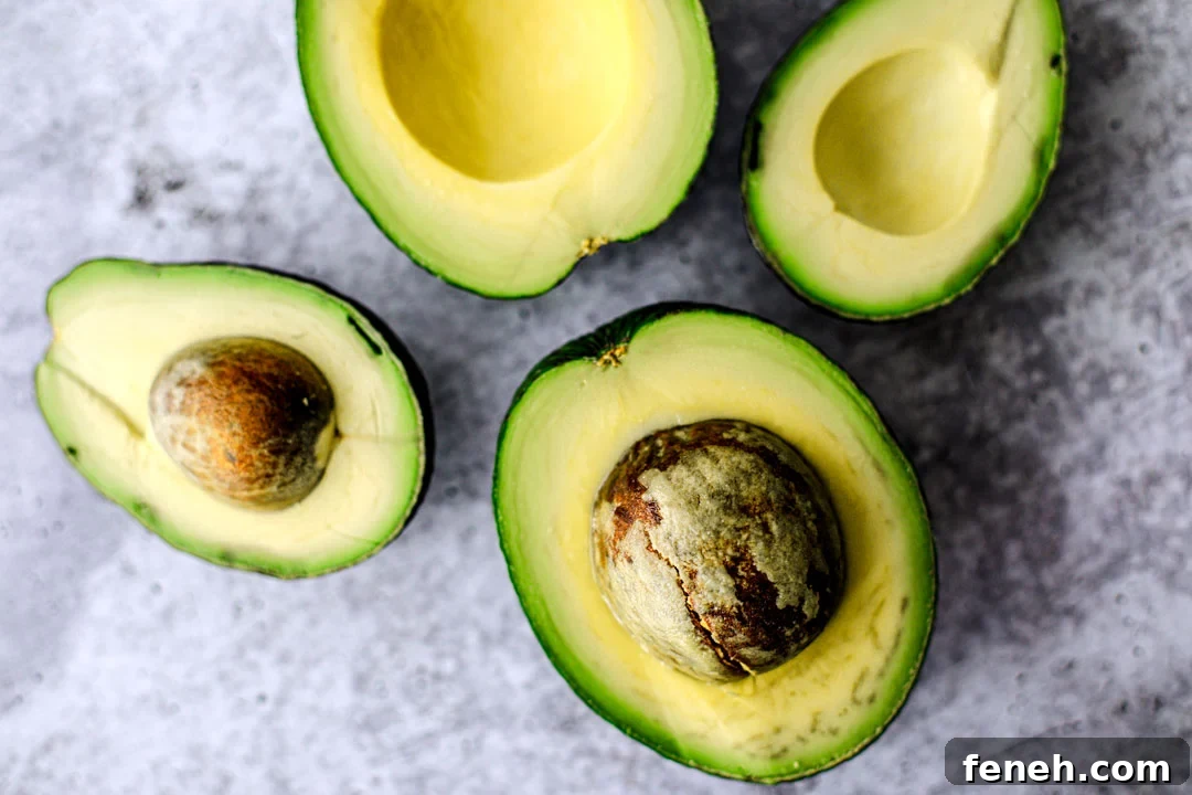 Avocados that have been sliced open.