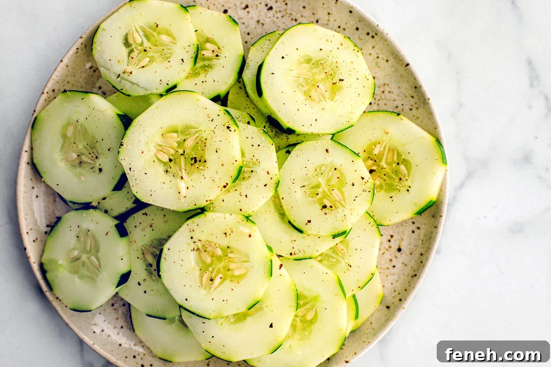 Plate full of peppered cucumber slices.