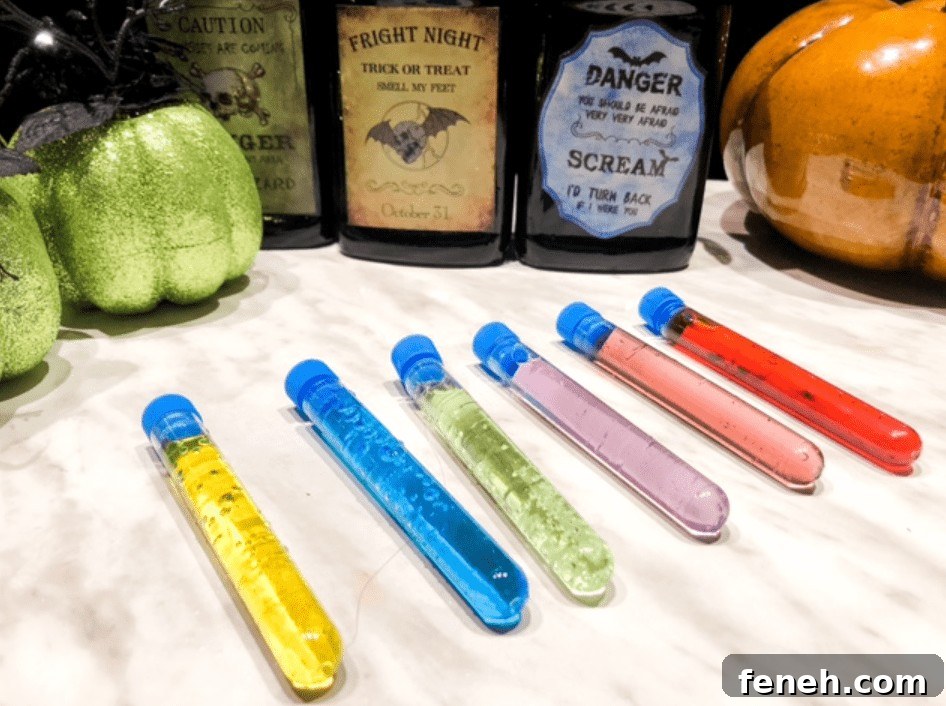 Halloween Shot Recipes and Spooky Shooter Ideas for Parties 9 Test tube shooters on table for Halloween party.