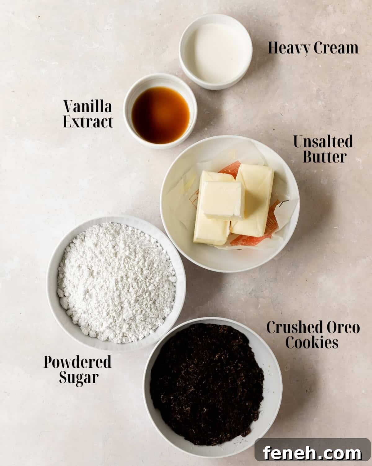Oreo Frosting Ingredients:  Gather unsalted butter, powdered sugar, heavy cream, vanilla extract and Oreo cookies. 