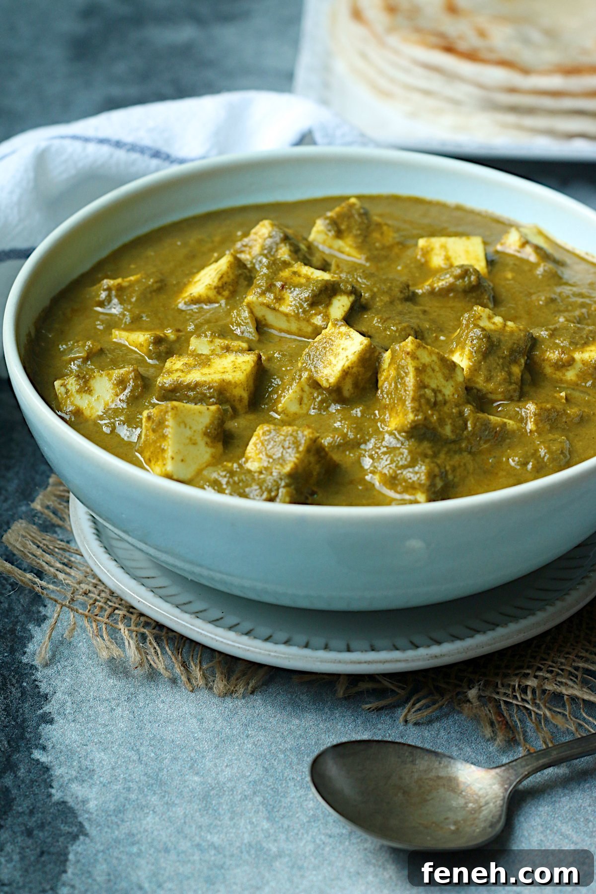Homemade Palak Paneer in a pale blue bowl.