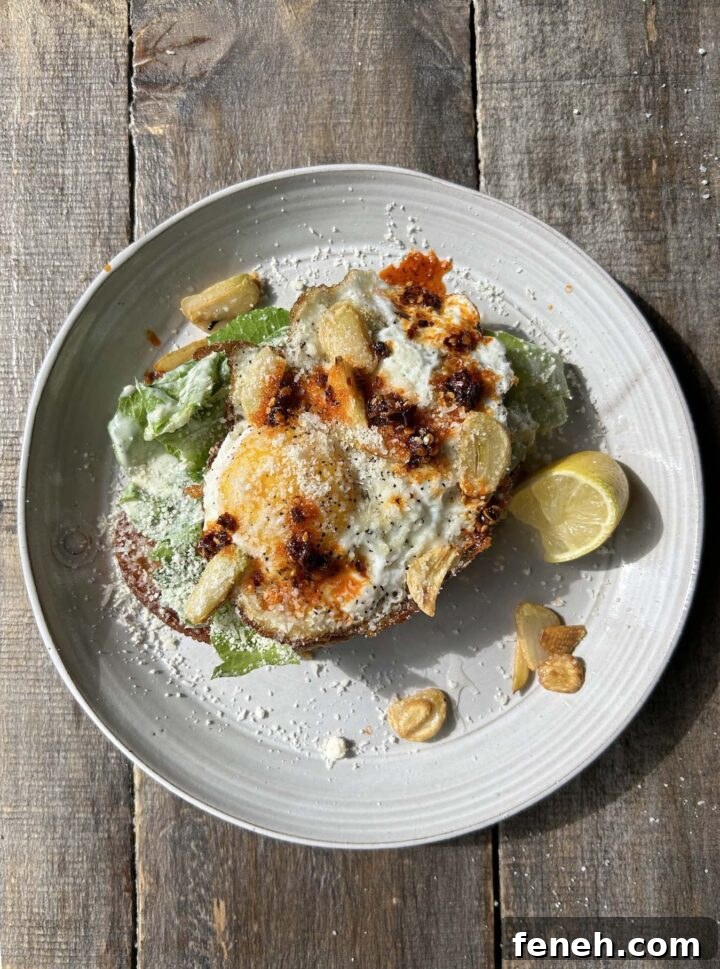 A finished piece of Caesar Salad Toast