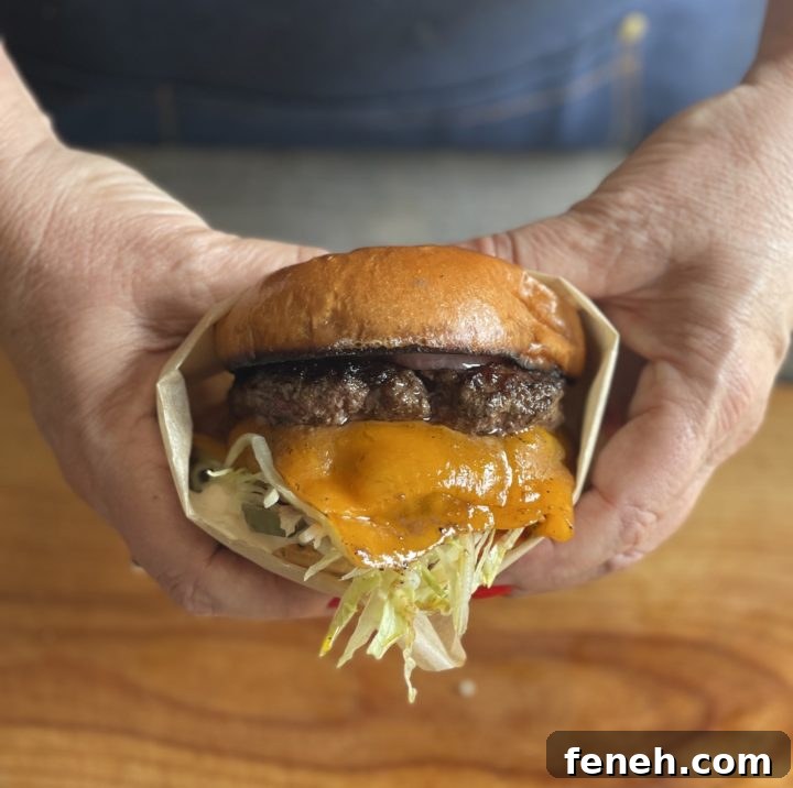 Teri holding a smashburger