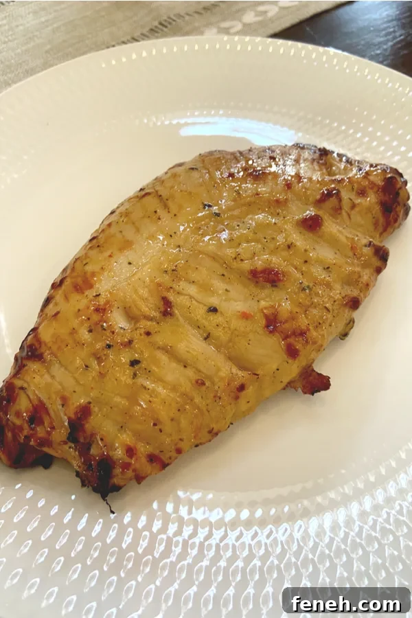 cooked turkey tenderloin on white plate 