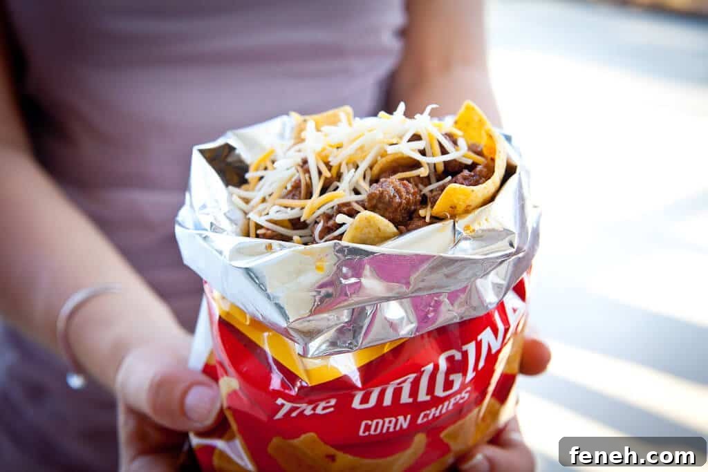 hand holding frito pie in bag