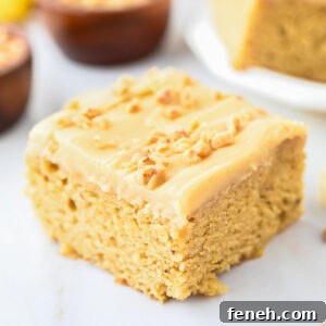 Banana Blondie topped with frosting and chopped nuts.