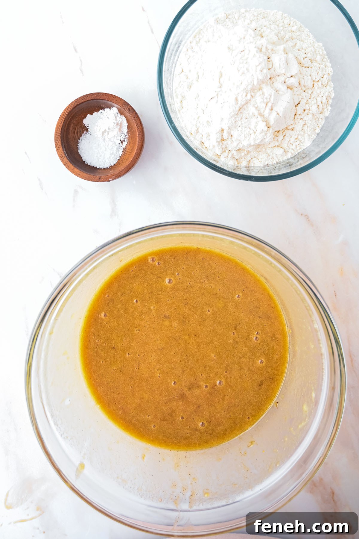 Egg, sour cream, mashed bananas, and vanilla added to the brown sugar butter mixture in the mixing bowl.