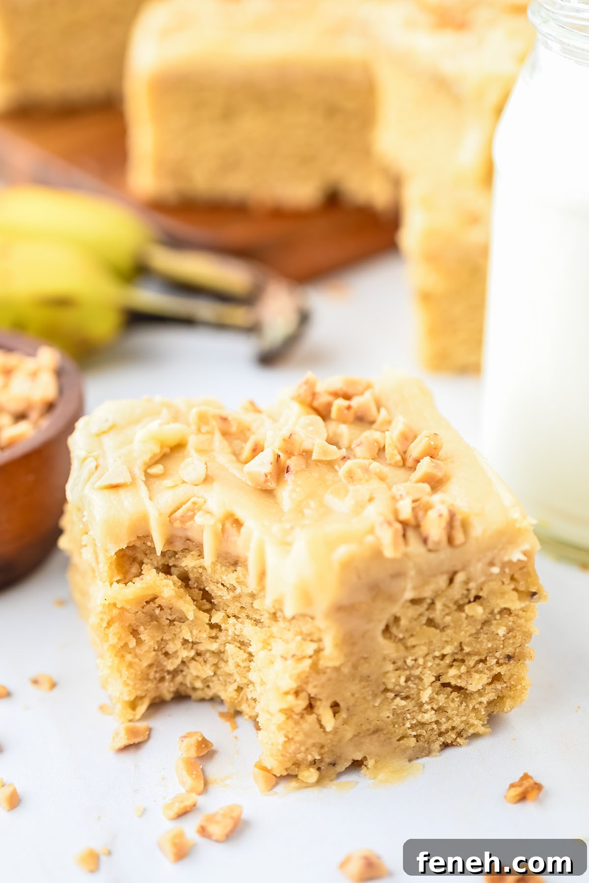 A slice of Banana Blondie with a bite missing.