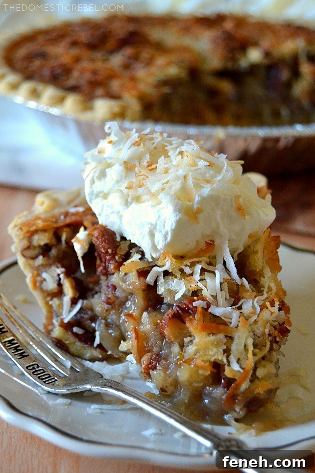 Closeup slice of coconut pecan pie on white plate with silver fork