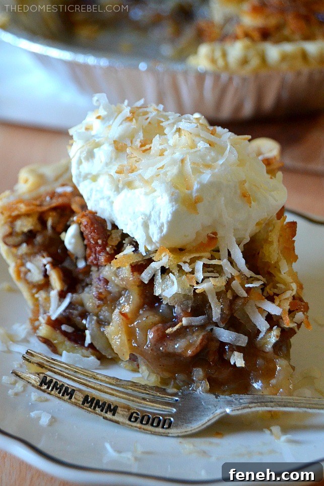 Closeup slice of coconut pecan pie with a bite missing and a silver fork