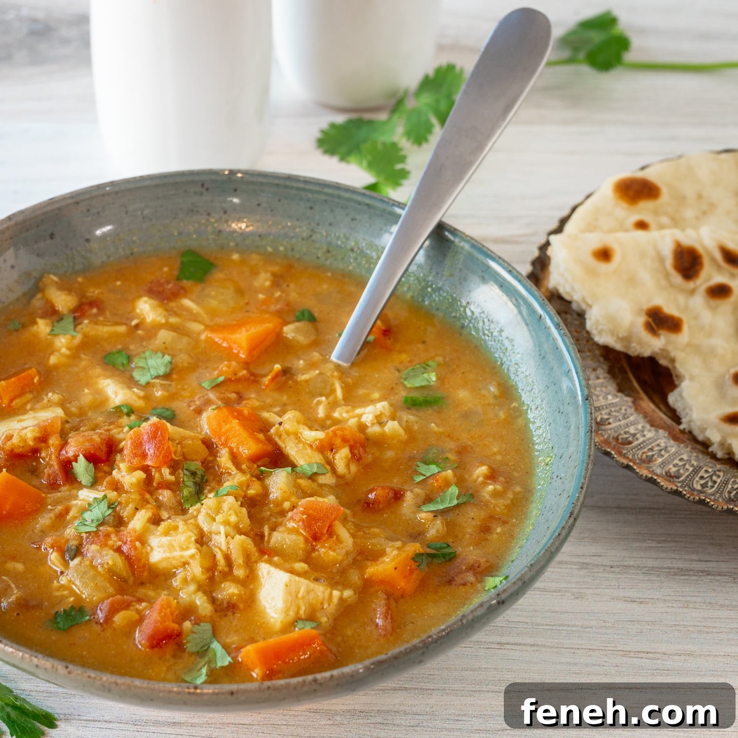 A bowl of chicken mulligatawny soup cooked in the Instant Pot pressure cooker.