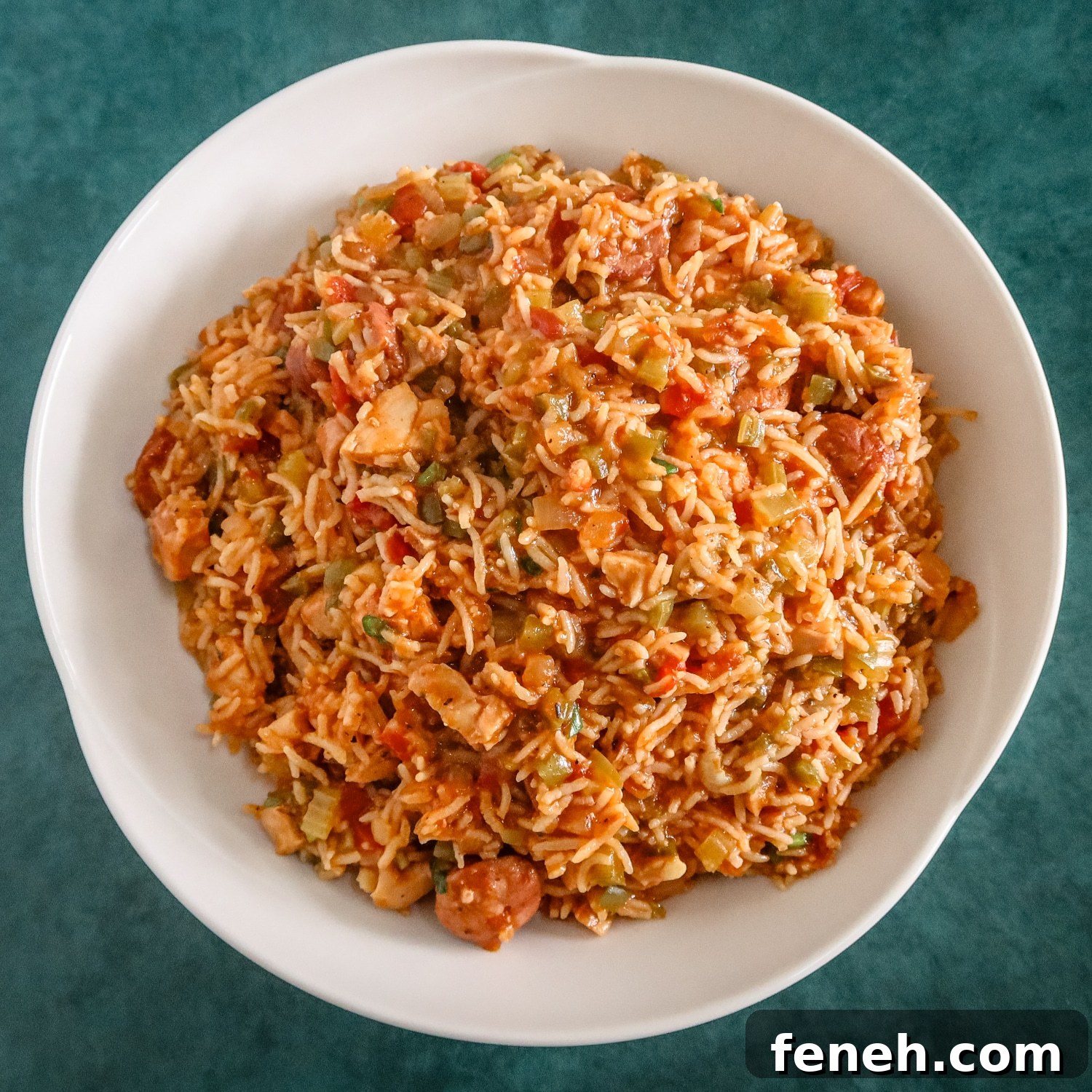 A serving bowl of Instant Pot jambalaya with chicken and spicy sausage.
