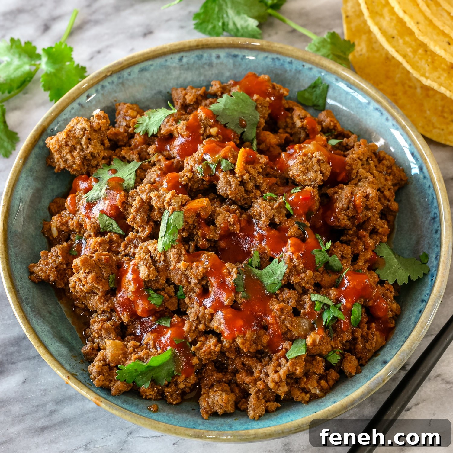 Instant Pot taco meat in a bowl with cilantro.