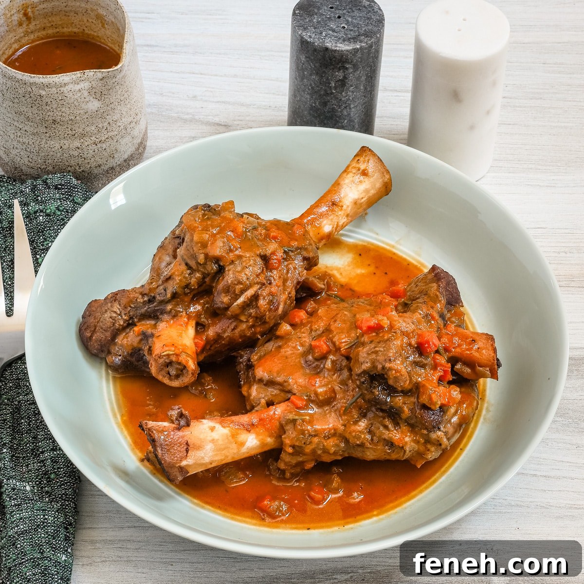 Braised lamb shanks in a bowl.