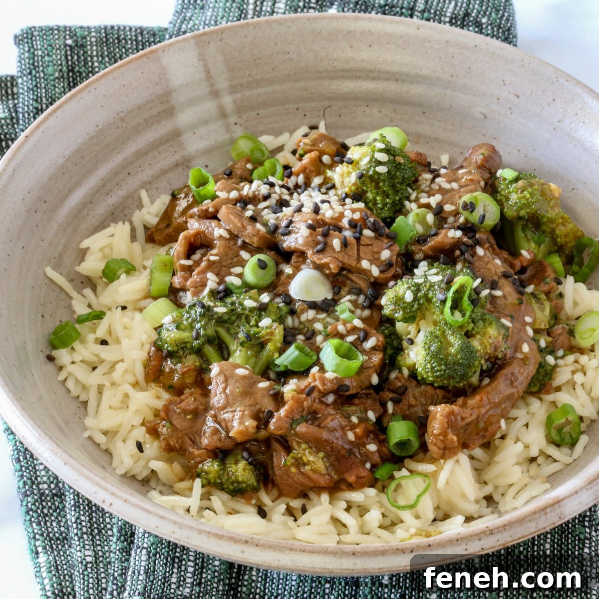 Instant Pot cooked beef and broccoli served on rice.