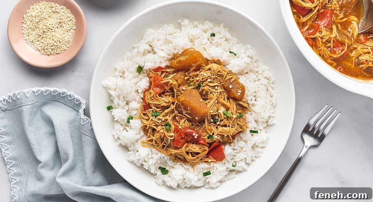 A plate of rice with pineapple chicken on top.
