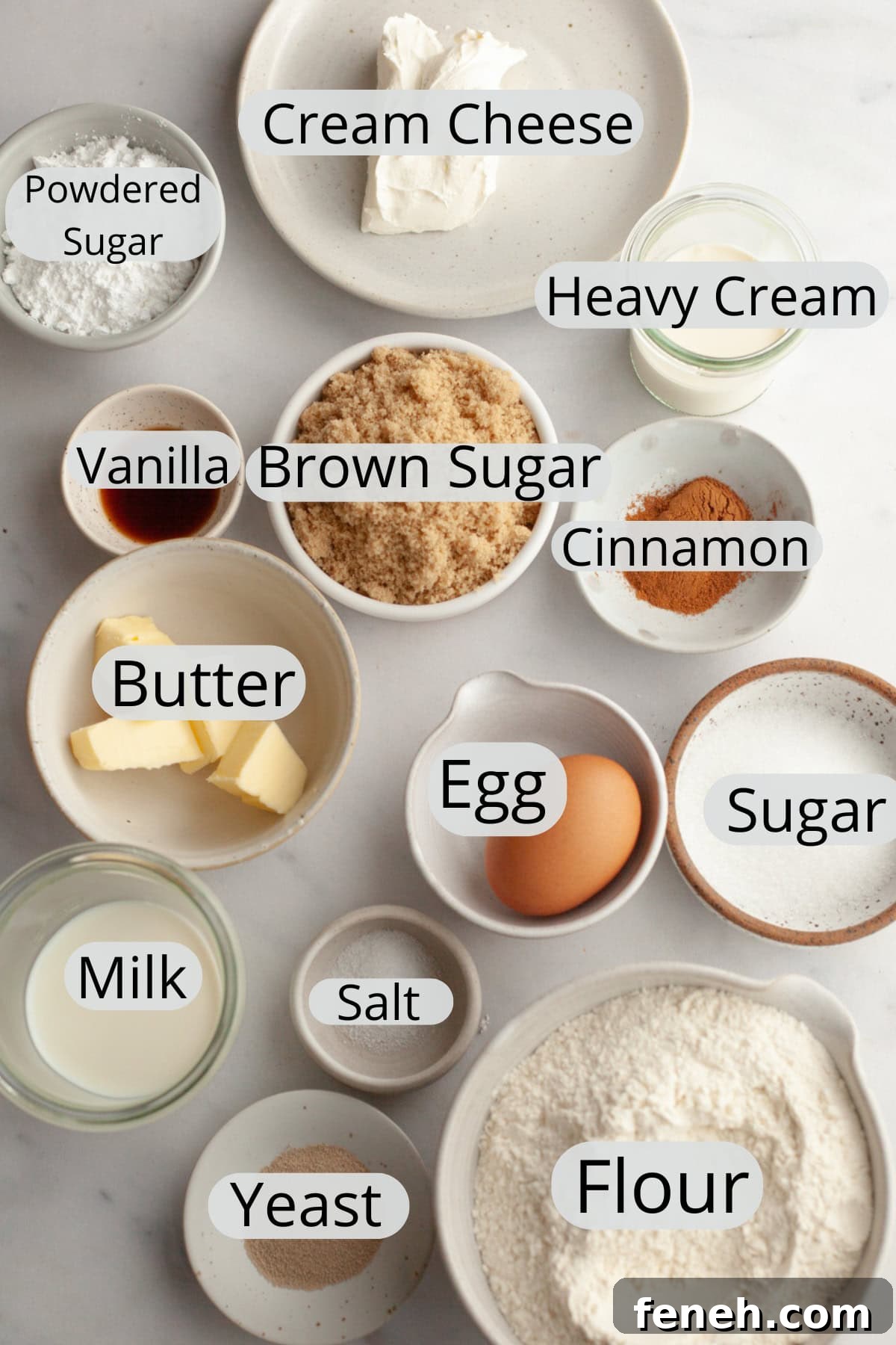 All the ingredients needed to make small batch cinnamon rolls, weighed out into small bowls.