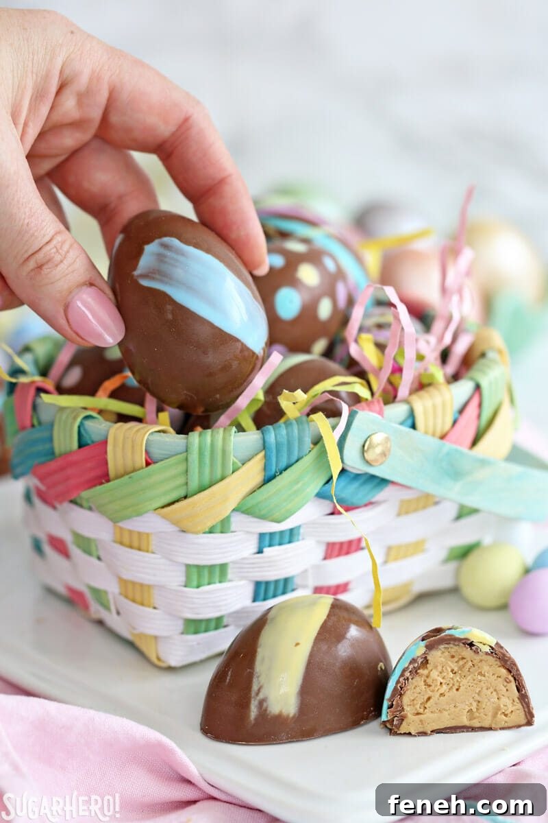Hand taking a Peanut Butter Easter Egg out of a pastel Easter basket