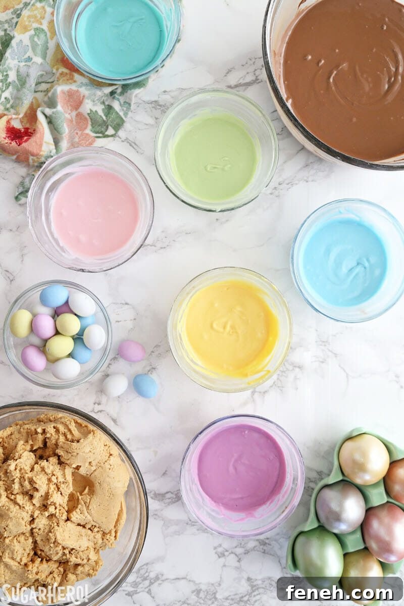 Overhead shot of melted pastel candy coating on a white marble surface