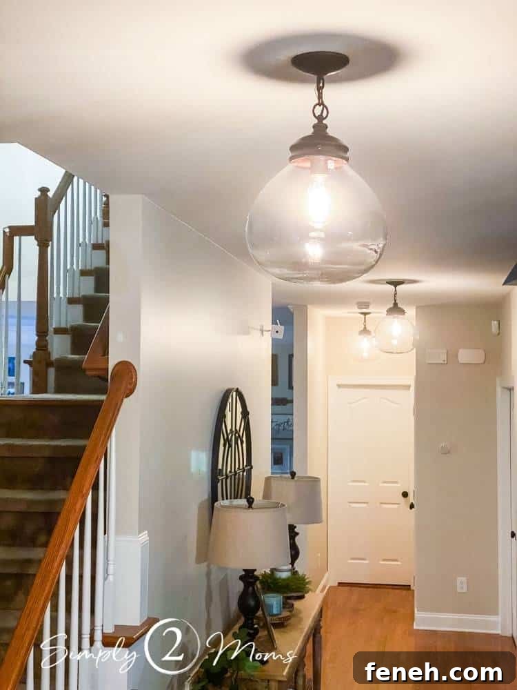 three lights hanging from hallway ceiling after they were cleaned
