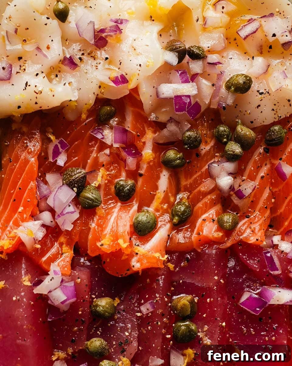 close up view of Sicilian sashimi topped with capers, olive oil, and red onions
