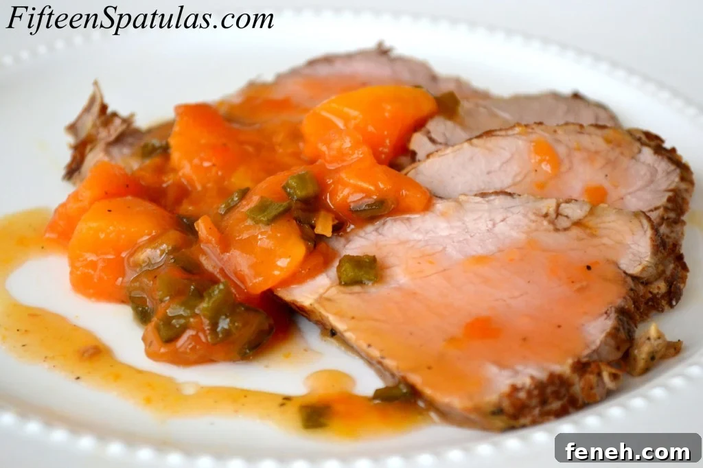 Slices of Pork Tenderloin with Peach Serrano Sauce on Top