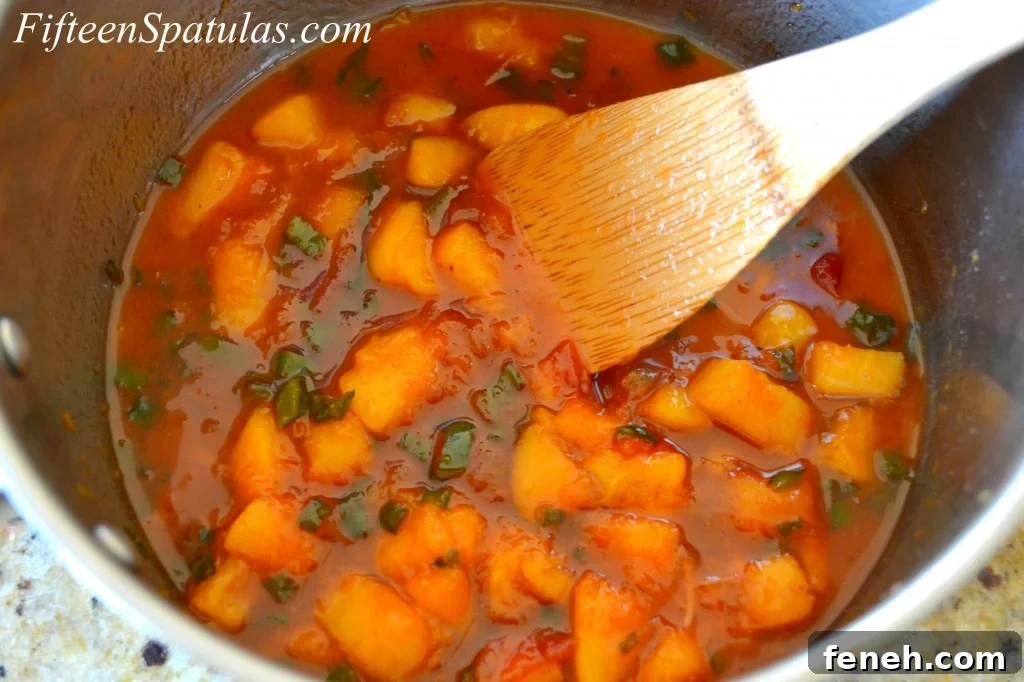 Peach Sauce for Pork - Shown in Saucepan with Chunks of Tender Peaches
